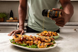 Dale's Buttery Steakhouse Blend seasoning grilled shrimp in a kitchen setting 